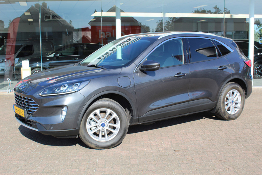 Ford Kuga 2.5-225pk PHEV Titanium X Plug-In Hybrid. Fabr. garantie t/m 07-04-2028 ! Slechts 10.000km ! Autm. airco dual, stoel-, stuur- en voorraamverw., LED verl., B&O soundsyst., metallic lak, cruise control, camera, LM wielen, elektr. achterklep en best. stoel etc.