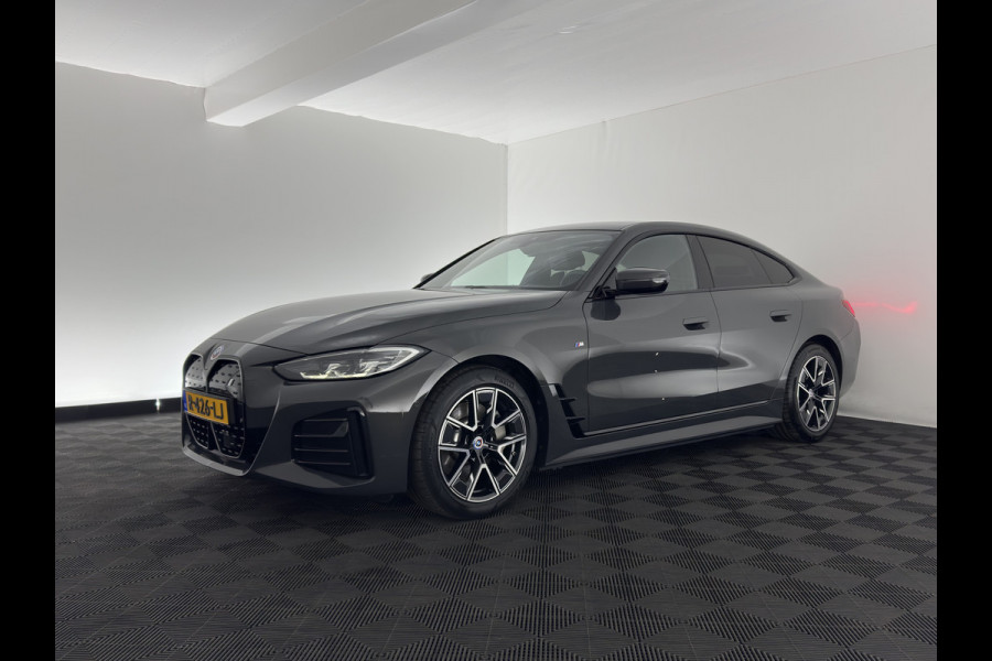 BMW i4 eDrive40 84 kWh M-Sportpack [ 3-Fase ] { SOH-95%} (INCL-BTW) *LEATHER-ALCANTARA | FULL-LED | ADAPTIVE-CRUISE | WIDE-SCREEN-DIGI-COCKPIT | DAB+ | CAMERA | AMBIENT-LIGHT | CARPLAY | SPORT-SEATS | PRIVACY-GLASS | TOWBAR | 18''ALU*