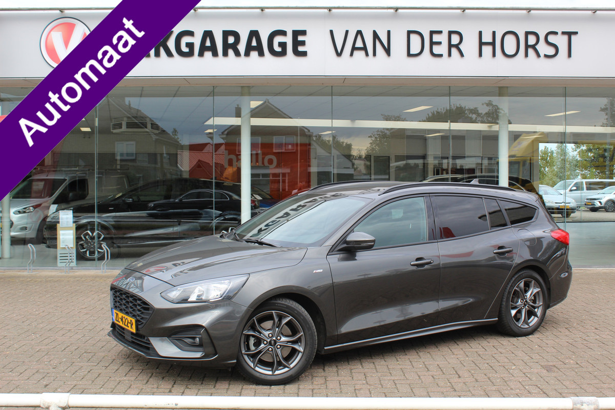 Ford FOCUS Wagon 1.0-125pk EcoBoost ST-Line AUTOMAAT ! Heel erg nette en goed onderhouden Ford Focus ST-Line wagon automaat. Volautm. airco dual, stoel-, stuur- en voorraamverw., camera, trekhaak, navigatie, telefoonvoorb., LM wln, cruise cntrl, skiluik etc., etc.... Ford FOCUS Wagon 1.0-125pk EcoBoost ST-Line AUTOMAAT ! Heel erg nette en goed onderhouden Ford Focus ST-Line wagon automaat. Volautm. airco dual, stoel-, stuur- en voorraamverw., camera, trekhaak, navigatie, telefoonvoorb., LM wln, cruise cntrl, skiluik etc., etc....