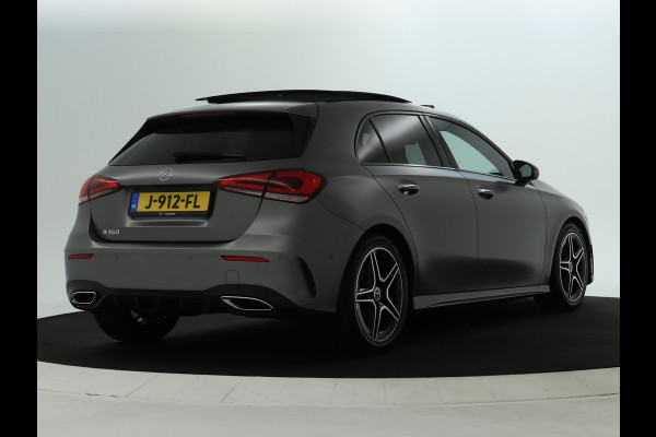 Mercedes-Benz A-Klasse 160 Business Solution AMG Panoramadak | 5 spaaks lichtmetalen velgen | Navigatie | Parking support met camera achter | elect bed. voorstoelen met memory | Inclusief 48 maanden Mercedes-Benz Certified garantie voor Europa.