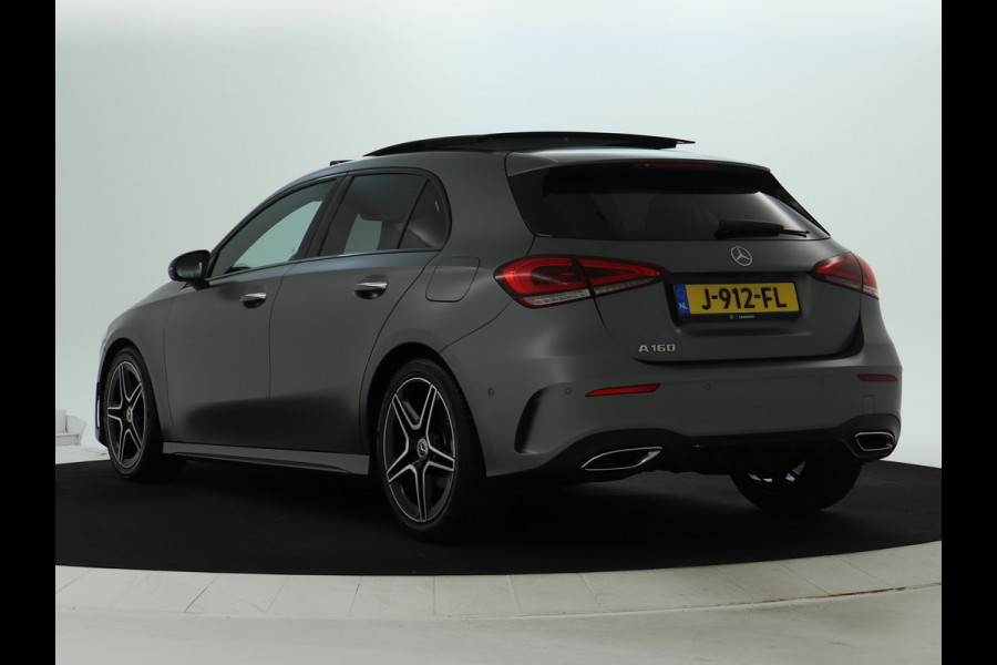 Mercedes-Benz A-Klasse 160 Business Solution AMG Panoramadak | 5 spaaks lichtmetalen velgen | Navigatie | Parking support met camera achter | elect bed. voorstoelen met memory | Inclusief 48 maanden Mercedes-Benz Certified garantie voor Europa.