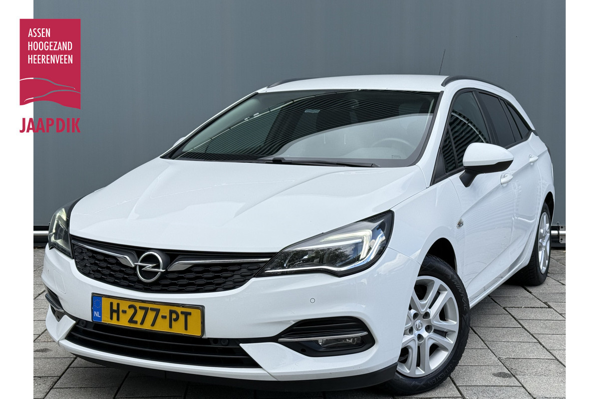 Opel Astra Sports Tourer BWJ 2020 | 1.2T 146PK Business Ed | TRKEHAAK | CLIMA | NAVI | PDC | CRUISE | CARPLAY | CAMERA | Opel Astra Sports Tourer BWJ 2020 | 1.2T 146PK Business Ed | TRKEHAAK | CLIMA | NAVI | PDC | CRUISE | CARPLAY | CAMERA |
