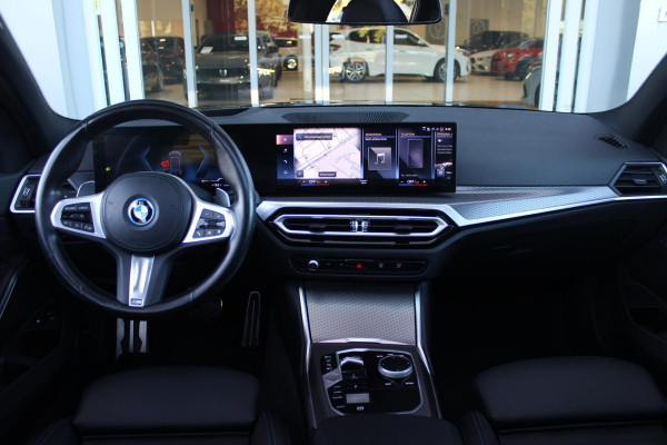 BMW 3 Serie Touring 320e 205PK M-SPORT | PANORAMISCH SCHUIF/KANTEL DAK | M-SPORT PAKKET INTERIEUR/EXTERIEUR | SFEER VERLICHTING | ELEKTRISCH BEDIENBARE VOORSTOELEN MET GEHEUGEN OP DE BESTUURDERSSTOEL | STOEL VERWARMING | HEAD UP DISPLAY | CRUISE CONTROL | NAVIGATIE | DRAADLOZE APPLE CARPLAY/ANDROID AUTO | DRAADLOZE TELEFOONLADER | 18" LICHTMETALEN VELGEN M-SPORT | 360° CAMERA | BMW LIVE DASHBOARD PROFESSIONAL | COMFORT ACCESS | SHADOW LINE PAKKET | FULL LED KOPLAMPEN | NAVIGATIE | CLIMATE CONTROL ACHTERIN |