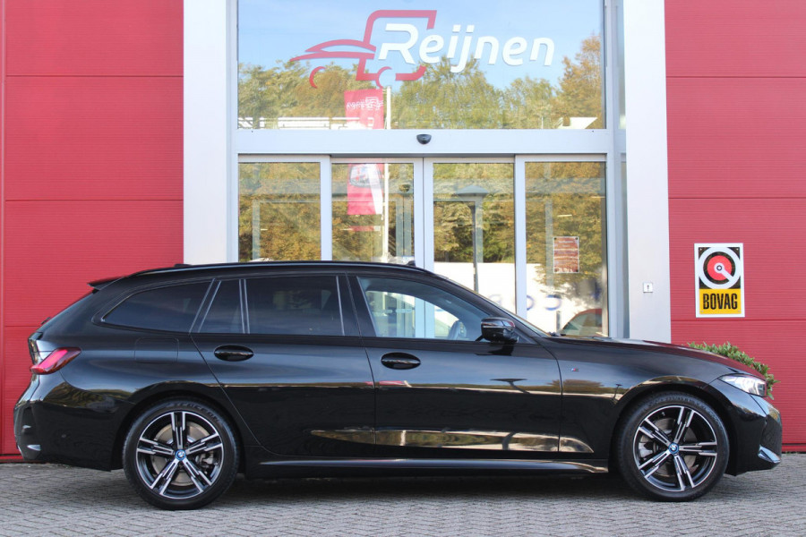 BMW 3 Serie Touring 320e 205PK M-SPORT | PANORAMISCH SCHUIF/KANTEL DAK | M-SPORT PAKKET INTERIEUR/EXTERIEUR | SFEER VERLICHTING | ELEKTRISCH BEDIENBARE VOORSTOELEN MET GEHEUGEN OP DE BESTUURDERSSTOEL | STOEL VERWARMING | HEAD UP DISPLAY | CRUISE CONTROL | NAVIGATIE | DRAADLOZE APPLE CARPLAY/ANDROID AUTO | DRAADLOZE TELEFOONLADER | 18" LICHTMETALEN VELGEN M-SPORT | 360° CAMERA | BMW LIVE DASHBOARD PROFESSIONAL | COMFORT ACCESS | SHADOW LINE PAKKET | FULL LED KOPLAMPEN | NAVIGATIE | CLIMATE CONTROL ACHTERIN |