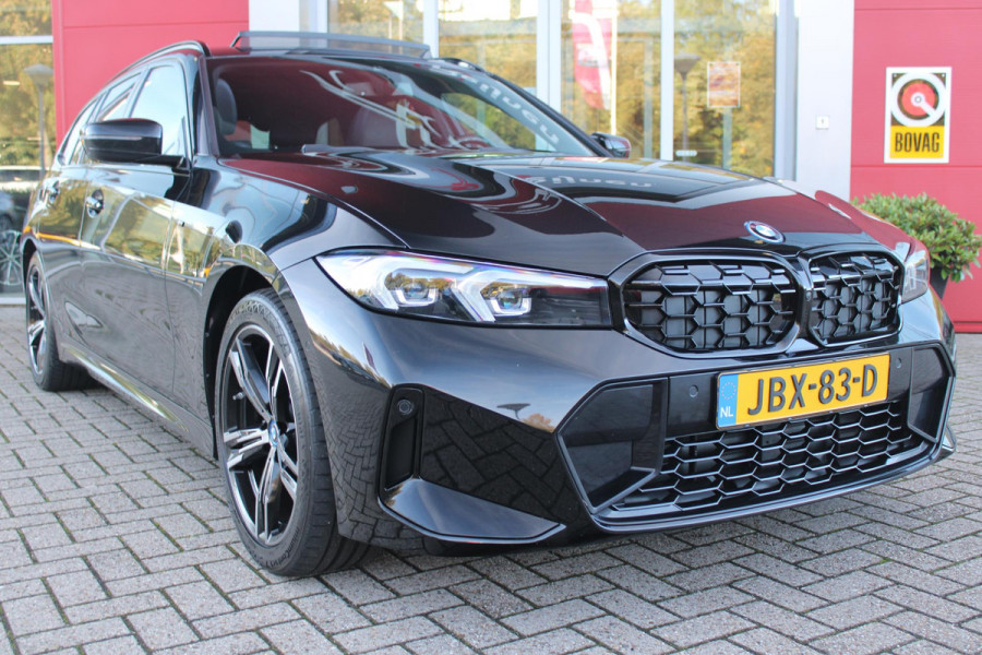 BMW 3 Serie Touring 320e 205PK M-SPORT | PANORAMISCH SCHUIF/KANTEL DAK | M-SPORT PAKKET INTERIEUR/EXTERIEUR | SFEER VERLICHTING | ELEKTRISCH BEDIENBARE VOORSTOELEN MET GEHEUGEN OP DE BESTUURDERSSTOEL | STOEL VERWARMING | HEAD UP DISPLAY | CRUISE CONTROL | NAVIGATIE | DRAADLOZE APPLE CARPLAY/ANDROID AUTO | DRAADLOZE TELEFOONLADER | 18" LICHTMETALEN VELGEN M-SPORT | 360° CAMERA | BMW LIVE DASHBOARD PROFESSIONAL | COMFORT ACCESS | SHADOW LINE PAKKET | FULL LED KOPLAMPEN | NAVIGATIE | CLIMATE CONTROL ACHTERIN |