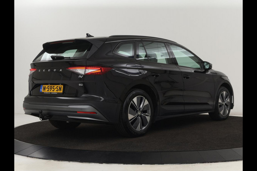 Škoda ENYAQ iV 60 | Stoelverwarming | Trekhaak | Matrix LED | Carplay | Stuurverwarming | Navigatie | Half leder | Cruise control | Parkeerhulp