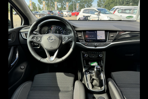 Opel Astra Sports Tourer 1.2 Blitz Elegance Schuif kanteldak Staat in Hardenberg