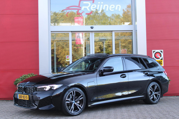 BMW 3 Serie Touring 320e 205PK M-SPORT | PANORAMISCH SCHUIF/KANTEL DAK | M-SPORT PAKKET INTERIEUR/EXTERIEUR | SFEER VERLICHTING | ELEKTRISCH BEDIENBARE VOORSTOELEN MET GEHEUGEN OP DE BESTUURDERSSTOEL | STOEL VERWARMING | HEAD UP DISPLAY | CRUISE CONTROL | NAVIGATIE | DRAADLOZE APPLE CARPLAY/ANDROID AUTO | DRAADLOZE TELEFOONLADER | 18" LICHTMETALEN VELGEN M-SPORT | 360° CAMERA | BMW LIVE DASHBOARD PROFESSIONAL | COMFORT ACCESS | SHADOW LINE PAKKET | FULL LED KOPLAMPEN | NAVIGATIE | CLIMATE CONTROL ACHTERIN |