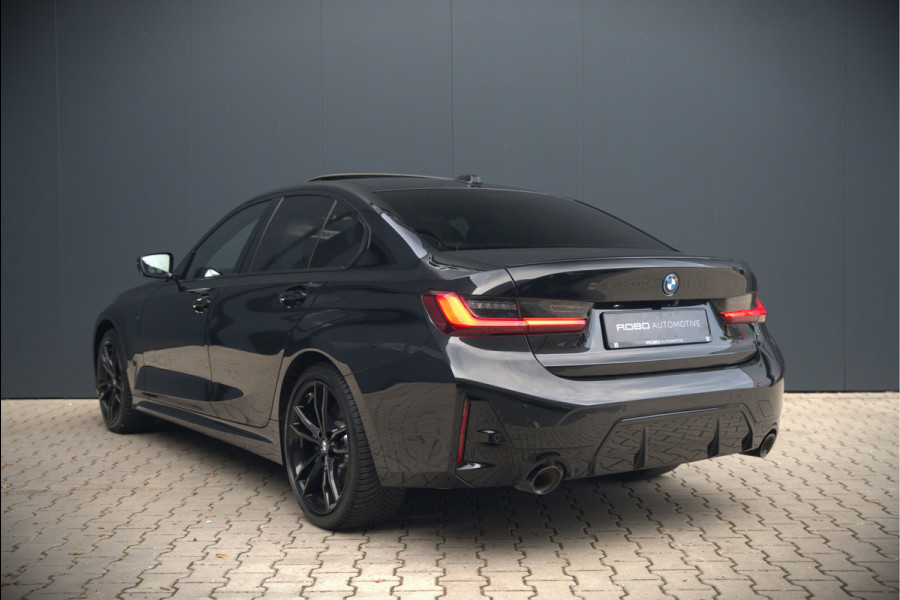BMW 3-serie 320e High Executive M Sport | Panoramadak | Harman Kardon | Carbon | Camera | Adaptive LED | Stoelverwarming | Stuurverwarming | Apple Carplay | Navigatie | Cruise Control | Memory Seat | Trekhaak | Keyless | Shadowline