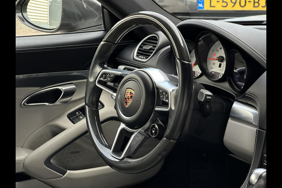 Porsche 718 Cayman 2.0 Sportchrono Adapt. Cruise BOSE Stuurverw. CarPlay Keyless LED 20”LM Agaatgrijs Porsche 718 Cayman 2.0 Sportchrono Adapt. Cruise BOSE Stuurverw. CarPlay Keyless LED 20”LM Agaatgrijs