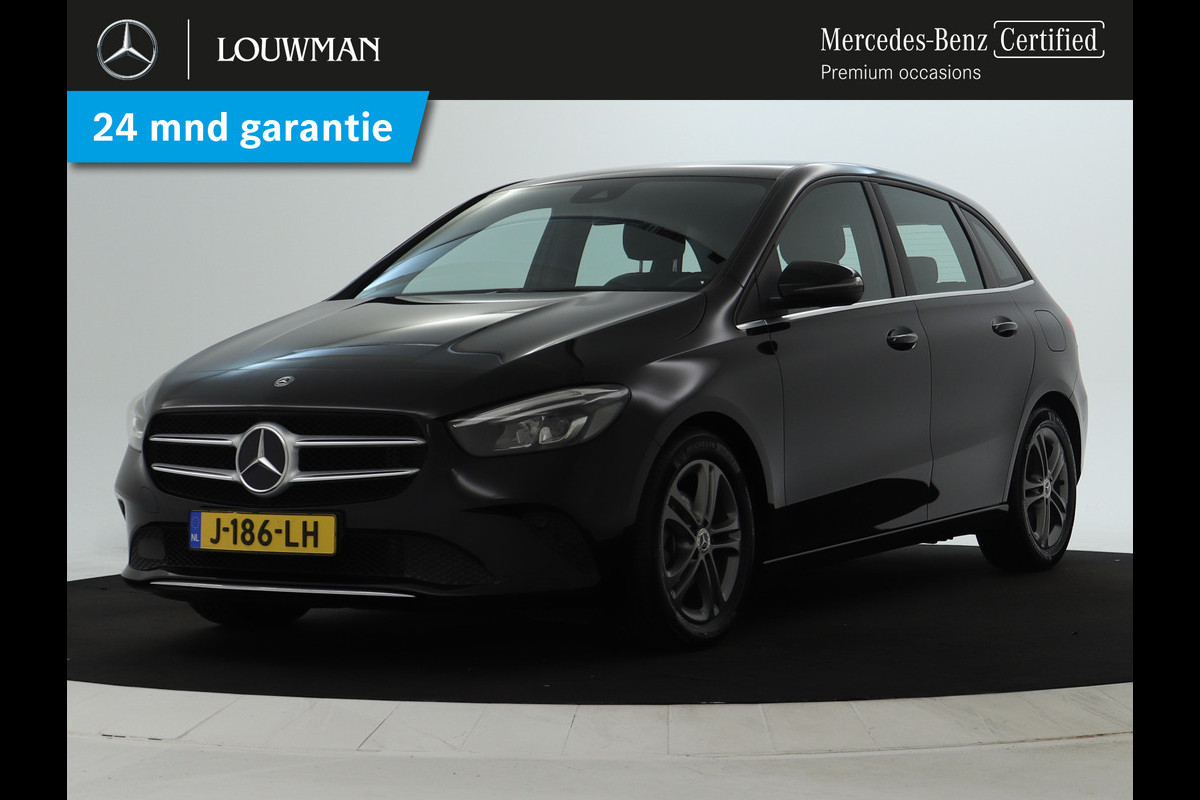 Mercedes-Benz B-Klasse 180 Advantage Achteruitrijcamera | Ledkoplampen | EASY PACK achterklep | Navigatiesysteem met harde schijf. Inclusief 24 maanden MB Certified garantie voor Europa. Mercedes-Benz B-Klasse 180 Advantage Achteruitrijcamera | Ledkoplampen | EASY PACK achterklep | Navigatiesysteem met harde schijf. Inclusief 24 maanden MB Certified garantie voor Europa.