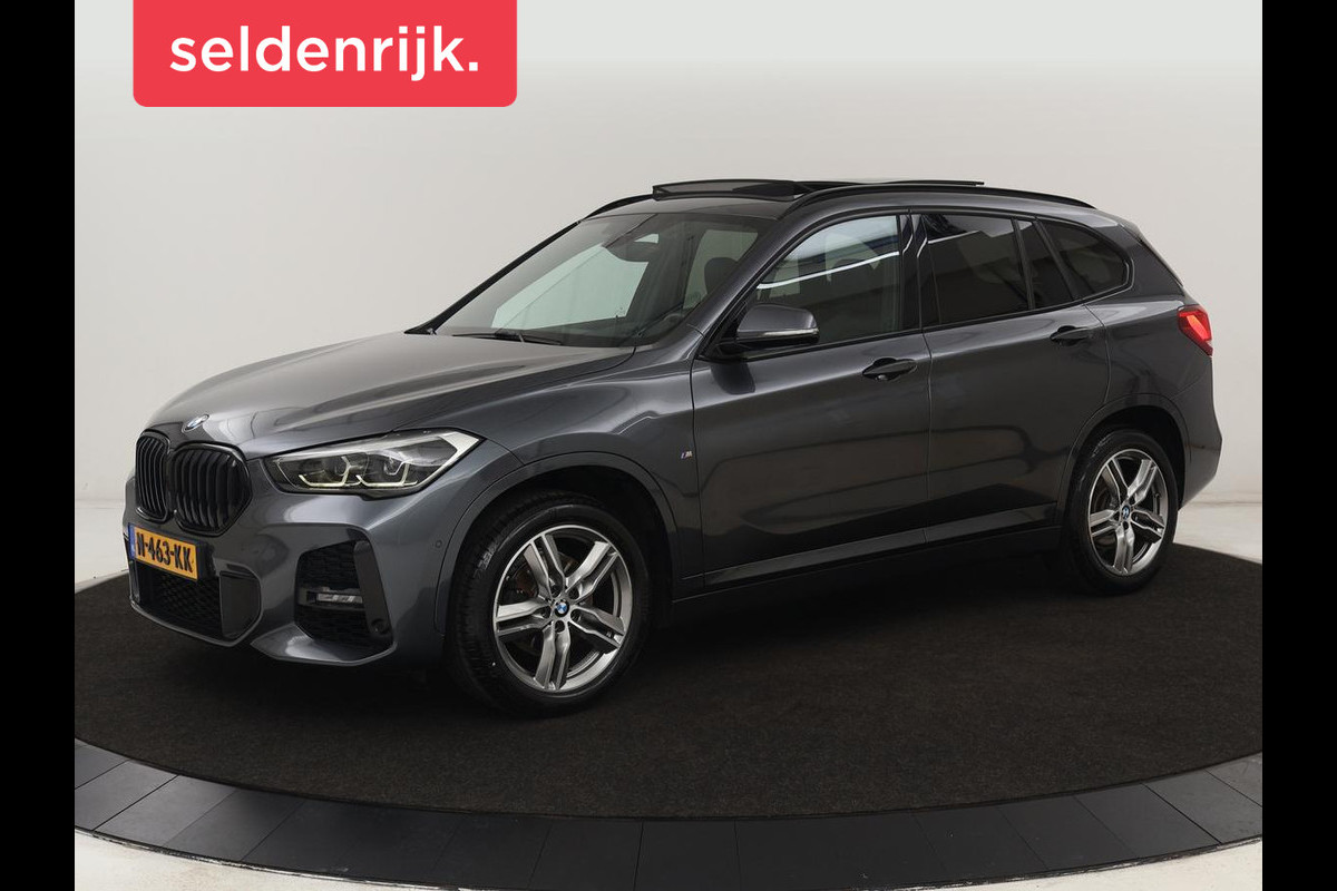 BMW X1 sDrive18i M Sport | Panoramadak | Leder | Stoelverwarming | Keyless | Camera | Trekhaak | Sfeerverlichting | Navigatie | Full LED | Park Assist | Sportstoelen BMW X1 sDrive18i M Sport | Panoramadak | Leder | Stoelverwarming | Keyless | Camera | Trekhaak | Sfeerverlichting | Navigatie | Full LED | Park Assist | Sportstoelen