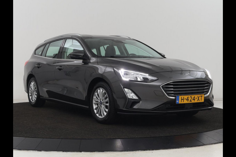 Ford Focus 1.0 EcoBoost Titanium | Trekhaak | Carplay | Navigatie | Keyless | Full LED | Parkeerhulp | Climate control | Cruise control Ford Focus 1.0 EcoBoost Titanium | Trekhaak | Carplay | Navigatie | Keyless | Full LED | Parkeerhulp | Climate control | Cruise control