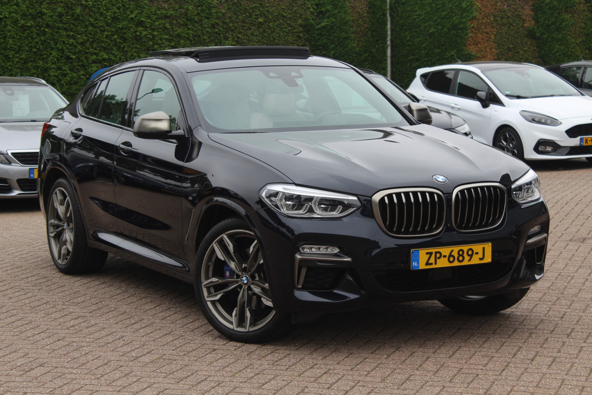 BMW X4 M40i High Executive / Trekhaak / Panoramadak / Camera / Head-up / Luxe Leder / 21'' / Harman Kardon / Navigatie / Stuur+Stoelverwarming / DAB / Dodehoek / Cruise Control BMW X4 M40i High Executive / Trekhaak / Panoramadak / Camera / Head-up / Luxe Leder / 21'' / Harman Kardon / Navigatie / Stuur+Stoelverwarming / DAB / Dodehoek / Cruise Control
