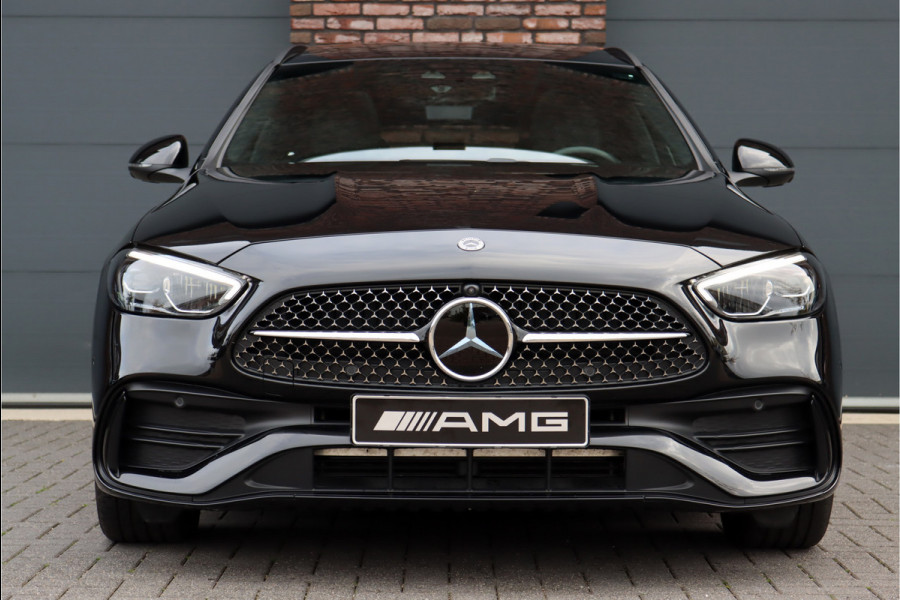 Mercedes-Benz C-Klasse Estate 300 e AMG Line | Panoramadak | Distronic | Trekhaak | Memory | Sfeerverlichting Premium | Stoelverwarming | Nightpakket | Camera | Dodehoekassistent |