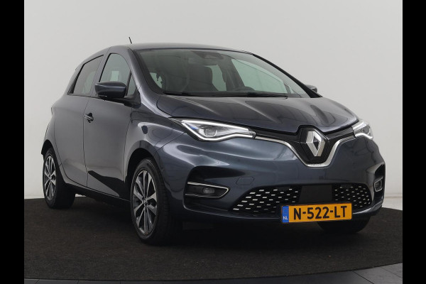 Renault ZOE R135 Intens 52 kWh | Warmtepomp | Carplay | Camera | Half leder | Keyless | Navigatie | Climate control | DAB | Cruise control Renault ZOE R135 Intens 52 kWh | Warmtepomp | Carplay | Camera | Half leder | Keyless | Navigatie | Climate control | DAB | Cruise control