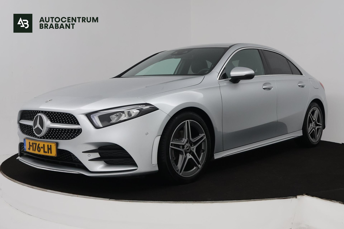 Mercedes-Benz A-Klasse 180 Business Solution AMG (STOELVERWARMING, SFEERVERLICHTING, ACHTERUITRIJCAMERA, CRUISE CONTROL, NAVI)