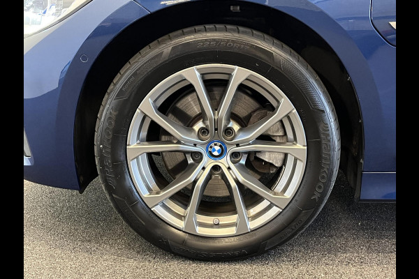 BMW 3 Serie Touring 320e Sportline Aut-8 Panoramadak Head Up Display Laser Licht Adaptive Cruise Trekhaak Leder Navi Parkeer Sensoren
