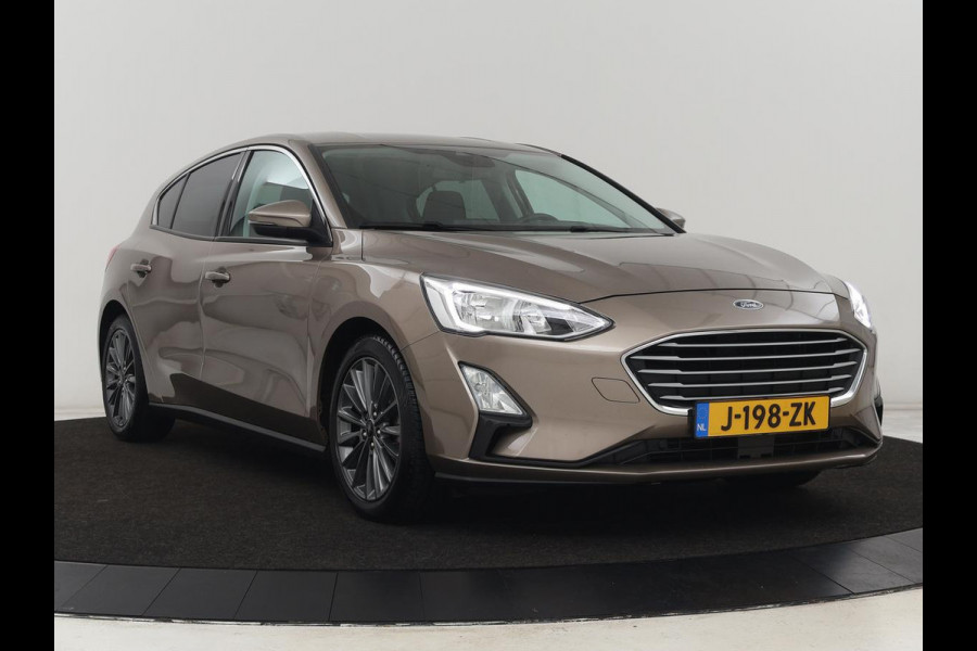 Ford Focus 1.0 EcoBoost Titanium | Trekhaak | Stoel & stuurverwarming | Carplay | Navigatie | Climate control | Keyless | Cruise control | Parkeerhulp | Bluetooth