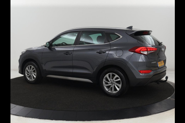 Hyundai Tucson 1.6 GDi Comfort | Trekhaak | Camera | Achterbankverwarming | Navigatie | Stoelverwarming | Climate control | Parkeerhulp | Cruise control | DAB | Regensensor Hyundai Tucson 1.6 GDi Comfort | Trekhaak | Camera | Achterbankverwarming | Navigatie | Stoelverwarming | Climate control | Parkeerhulp | Cruise control | DAB | Regensensor