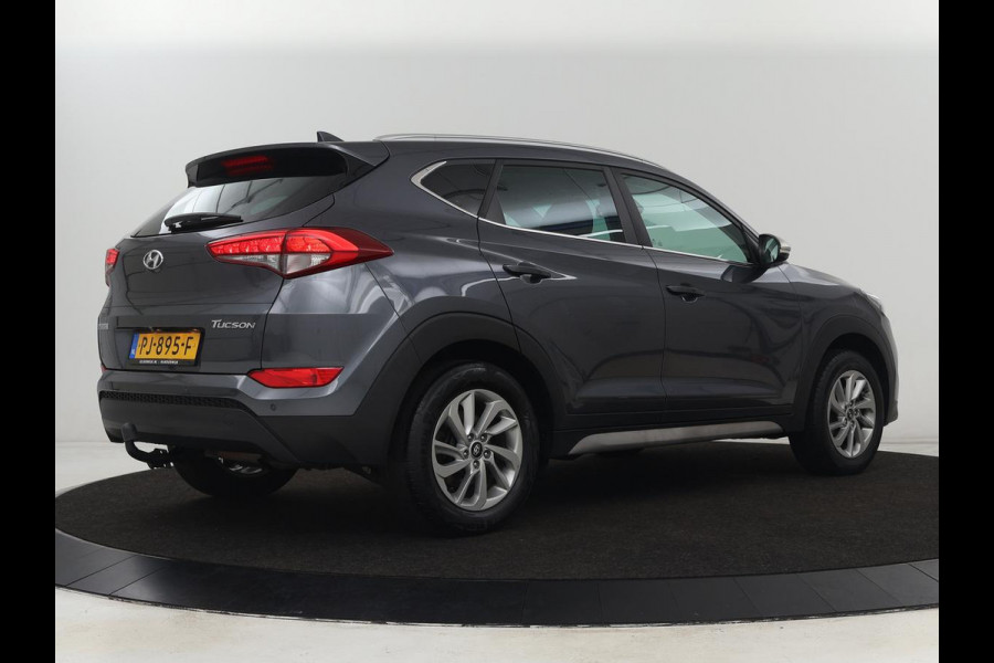 Hyundai Tucson 1.6 GDi Comfort | Trekhaak | Camera | Achterbankverwarming | Navigatie | Stoelverwarming | Climate control | Parkeerhulp | Cruise control | DAB | Regensensor Hyundai Tucson 1.6 GDi Comfort | Trekhaak | Camera | Achterbankverwarming | Navigatie | Stoelverwarming | Climate control | Parkeerhulp | Cruise control | DAB | Regensensor