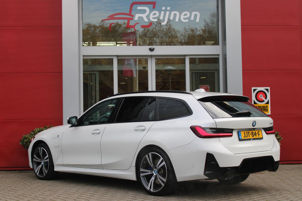 BMW 3 Serie Touring 330e 292PK M-SPORT | M-SPORT PRO-PAKKET | M-SPORT REMMEN UITGEVOERD IN DONKERBLAUW MET M LOGO | BMW LIVE COCKPIT PROFESSIONAL | CURVED DISPLAY |DRIVING ASSISTANT INCL. HEAD-UP DISPLAY | PANORAMISCH SCHUIF/KANTEL DAK | PARKING ASSIST INCL. ACHTERUITRIJCAMERA | ADAPTIEVE LED KOPLAMPEN |SHADOW LINE | M-SPORTSTOELEN VOOR | LEDER VERNASCA MET CONTRAST STIKSELS M-SPORT | STOEL VERWARMING | DRAADLOZE APPLE CARPLAY | ELEKTRISCH VERSTELBARE STOELEN MET GEHEUGEN FUNCTIE | HEAD UP DISPLAY | DRAADLOZE TELEFOONLADER | DODEHOEK BEWAKING | COMFORT PACK INCL. ELEKTRISCHE ACHTE