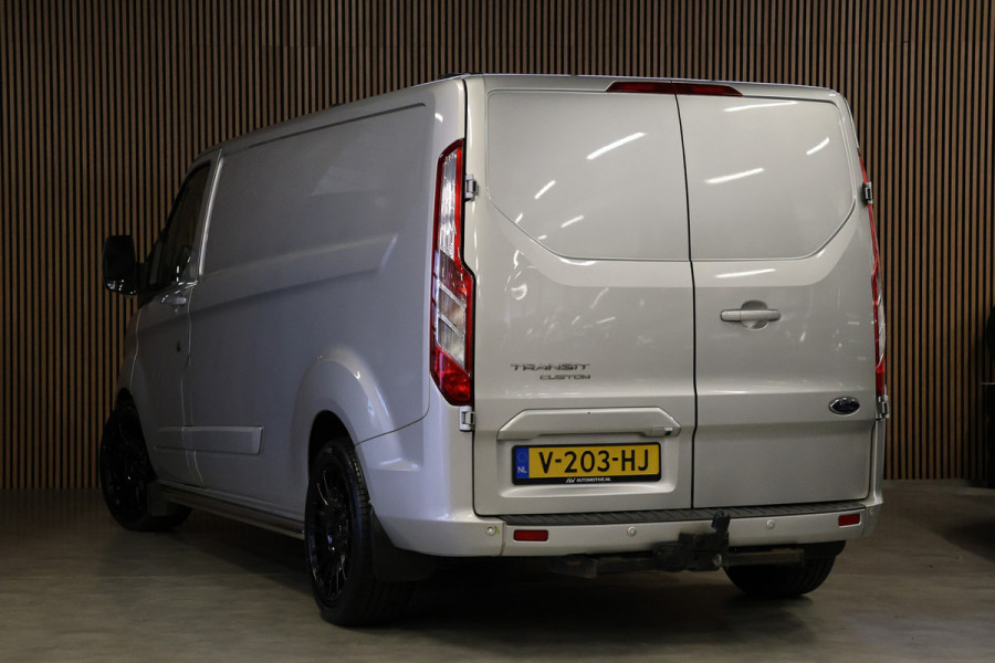 Ford Transit Custom 290 2.0 TDCI 170 PK L2H1 Limited | Standkachel | Navigatie | Stoelverwarming | Camera | Cruise control | Trekhaak | NAP Logisch | Dakdragers | Airco | 3-Zitter
