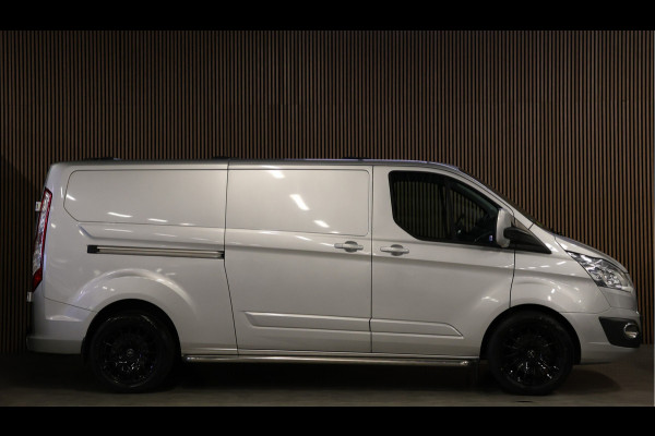 Ford Transit Custom 290 2.0 TDCI 170 PK L2H1 Limited | Standkachel | Navigatie | Stoelverwarming | Camera | Cruise control | Trekhaak | NAP Logisch | Dakdragers | Airco | 3-Zitter