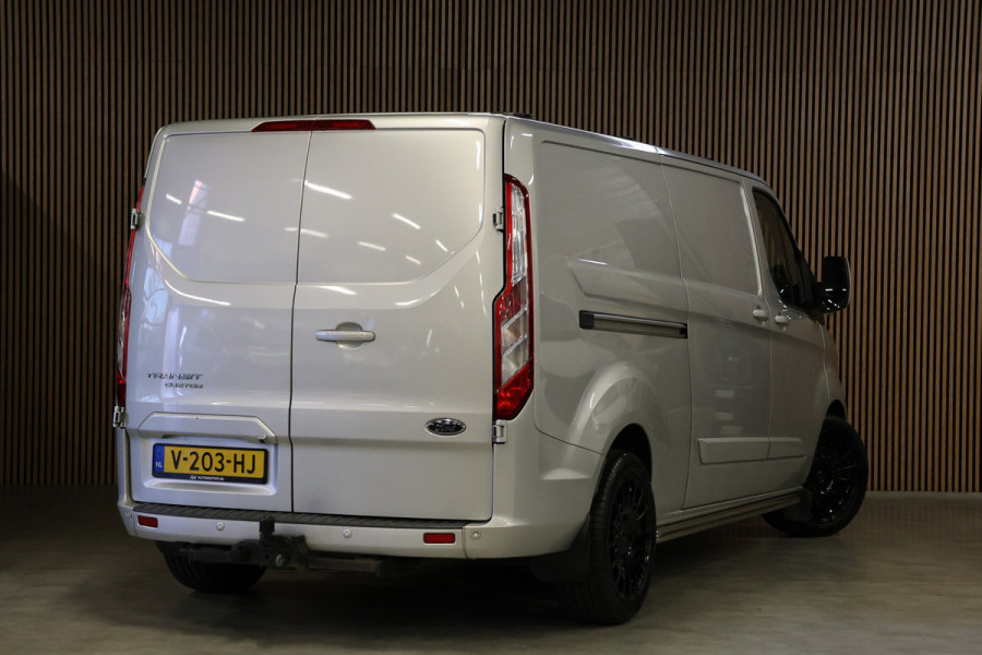 Ford Transit Custom 290 2.0 TDCI 170 PK L2H1 Limited | Standkachel | Navigatie | Stoelverwarming | Camera | Cruise control | Trekhaak | NAP Logisch | Dakdragers | Airco | 3-Zitter