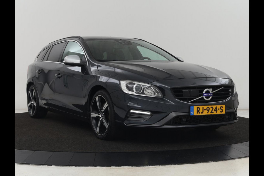 Volvo V60 2.0 T4 R Design | Stoel & stuurverwarming | Adaptive cruise | Trekhaak | Bi-Xenon | Camera | Achterbankverwarming | Keyless | Navigatie | Parkeerhulp | Bluetooth | Climate control