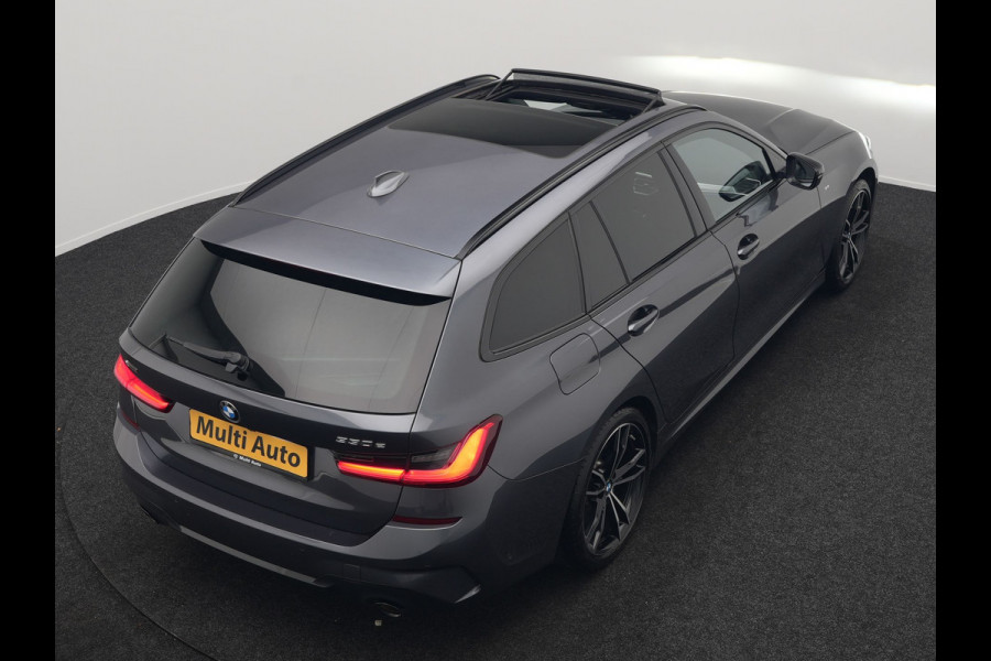 BMW 3 Serie Touring 330e xDrive M Sport Plug In Hybrid 293pk Dealer O.H. PHEV | Trekhaak Af Fabriek | Panodak | Harman & Kardon | Adaptief Onderstel | Camera | Alcantara Sportstoelen Verwarmd | Sfeerverlichting | Apple Carplay | Stuur Verwarmd | Navigatie | DAB |
