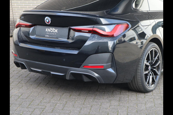 BMW i4 eDrive40 High Executive M Sport Pakket Automaat / Live Cockpit Professional / Schuif-/kanteldak / Driving Assistant / Leder / Hifi / M Sportremsysteem / Stoelverwarming / Extra Getint Glas /  M Achterspoiler / Shadow Line