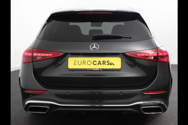 Mercedes-Benz C-Klasse Estate 200 AMG Line | Climate control | Achteruitrijcamera | Wegklapbare trekhaak | Navigatie | Dodehoek assistent | LED | Sfeerverlichting | Adaptieve cruise control | Verwarmde voorstoelen | Elektrische kofferbak