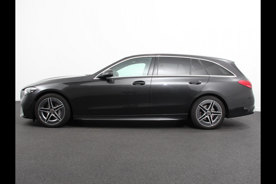Mercedes-Benz C-Klasse Estate 200 AMG Line | Climate control | Achteruitrijcamera | Wegklapbare trekhaak | Navigatie | Dodehoek assistent | LED | Sfeerverlichting | Adaptieve cruise control | Verwarmde voorstoelen | Elektrische kofferbak