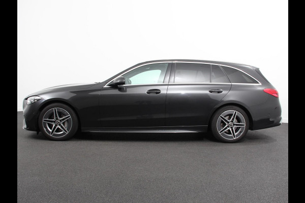 Mercedes-Benz C-Klasse Estate 200 AMG Line | Climate control | Achteruitrijcamera | Wegklapbare trekhaak | Navigatie | Dodehoek assistent | LED | Sfeerverlichting | Adaptieve cruise control | Verwarmde voorstoelen | Elektrische kofferbak