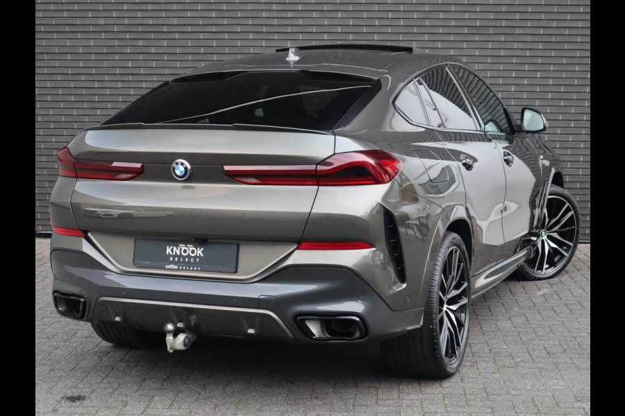 BMW X6 xDrive40i High Executive M Sport Pakket Automaat / Live Cockpit Professional / Panoramadak / Trekhaak / Bowers & Wilkins / Integrale Actieve Besturing / M Sportremsysteem / Driving Assistant Professional / Laserlicht / Iconic Glow / Comfortstoelen met massage  / 22 Inch/