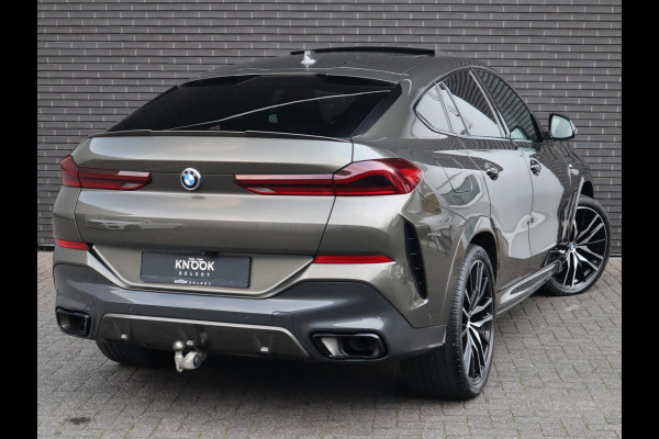 BMW X6 xDrive40i High Executive M Sport Pakket Automaat / Live Cockpit Professional / Panoramadak / Trekhaak / Bowers & Wilkins / Integrale Actieve Besturing / M Sportremsysteem / Driving Assistant Professional / Laserlicht / Iconic Glow / Comfortstoelen met massage  / 22 Inch/