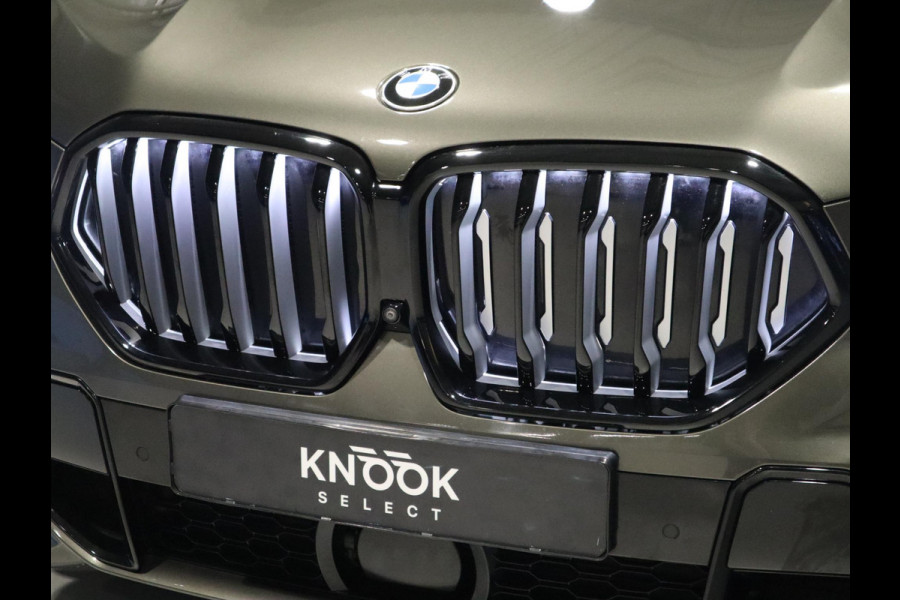 BMW X6 xDrive40i High Executive M Sport Pakket Automaat / Live Cockpit Professional / Panoramadak / Trekhaak / Bowers & Wilkins / Integrale Actieve Besturing / M Sportremsysteem / Driving Assistant Professional / Laserlicht / Iconic Glow / Comfortstoelen met massage  / 22 Inch/