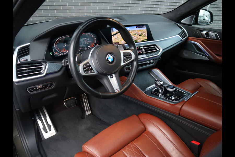 BMW X6 xDrive40i High Executive M Sport Pakket Automaat / Live Cockpit Professional / Panoramadak / Trekhaak / Bowers & Wilkins / Integrale Actieve Besturing / M Sportremsysteem / Driving Assistant Professional / Laserlicht / Iconic Glow / Comfortstoelen met massage  / 22 Inch/