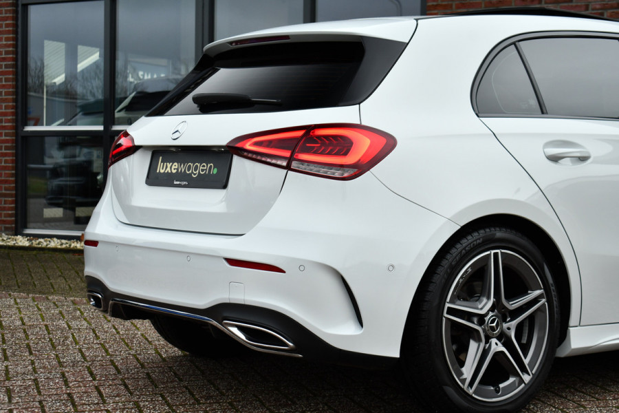 Mercedes-Benz A-Klasse 180 AMG Pano Trekhaak Camera Night Metallic-wit