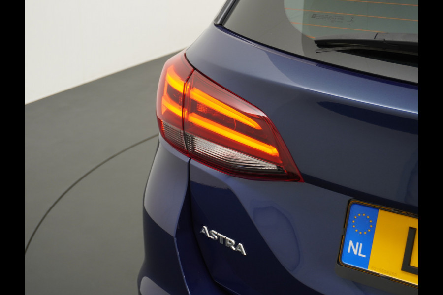 Opel Astra Sports Tourer 1.4T 145pk Navi Camera Lane-dep. Keyless 1/2Leer CruiseControl Led Bluetooth Pdc Apple/Android Aut.Verlichting Isofix Elek.Ramen Ecc Tel. Usb 16''LM Business Elegance