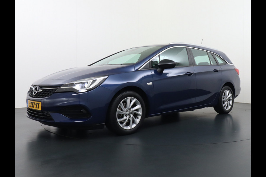 Opel Astra Sports Tourer 1.4T 145pk Navi Camera Lane-dep. Keyless 1/2Leer CruiseControl Led Bluetooth Pdc Apple/Android Aut.Verlichting Isofix Elek.Ramen Ecc Tel. Usb 16''LM Business Elegance