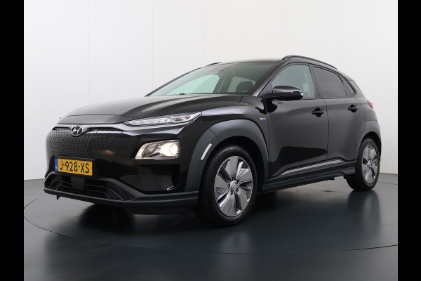 Hyundai Kona EV Fashion 64kWh SOH 100% Warmtepomp Head Up Display Adap.Cruise Navi Ecc Camera Apple Carplay Android Auto Pdc Lane Assist Dodehoekwaarschuwing Keyless Privacy Glas DAB FCA 1e Eigenaar Origineel Nederlandse Auto