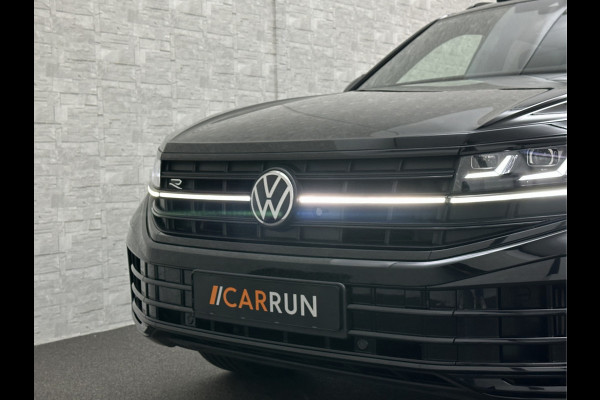 Volkswagen Touareg R 3.0 TSI 462PK E-Hybrid | Luchtvering | Puglia-Leder | Panorama | DYN-Audio | Massage | Ventilatie | ACC | Trekhaak | Nachtzicht | Head-Up | Ergo-Comfort | 22" | Keyless-Entry | Memory | 4-Zone Clima | ISO-Glas | Stoelverwarming V+A | Dodehoek | Standkachel | Carplay | Draadloos Laden |