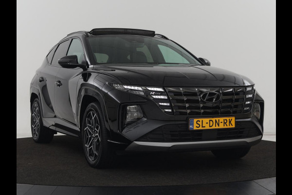 Hyundai Tucson 1.6 T-GDI PHEV N Line Sky 4WD | Panoramadak | Leder/Alcantara | Stoelverwarming | Camera | Carplay | Stuurverwarming | Keyless | Full LED | Navigatie | 19'' lichtmetalen velgen | Plug In