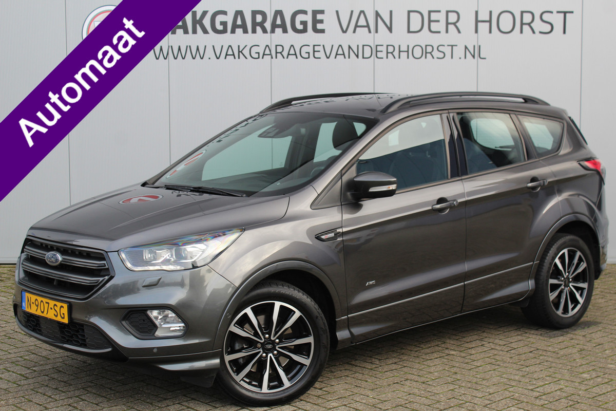 Ford Kuga 1.5-182pk EcoBoost ST-Line AWD-AUTOMAAT. Ideale caravantrekker: vierwielaangedreven automaat, trekgewicht 1.850kg ! Autm. airco dual, adapt. cruise cntrl, navigatie, telefoonvoorb., stoel- en voorraamverw., bi-xenon verl., lm wielen, camera, pdc v+a, Sony soundsyst., side- en laneassist etc.