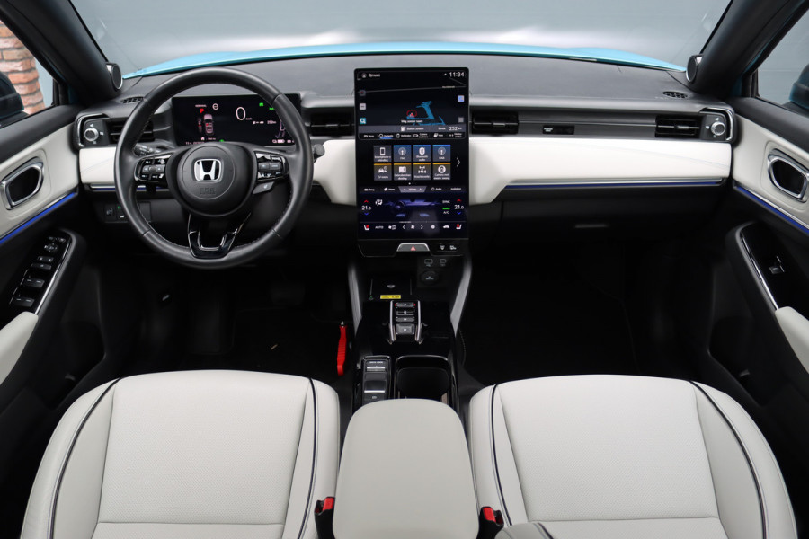Honda e:Ny1 Elegance 69 kWh | Panoramadak | Adaptieve Cruise Control | Verwarmd Stuurwiel | Leder | Surround Camera | Apple Carplay/Android Auto | Dodehoekassistent | Stoelverwarming |