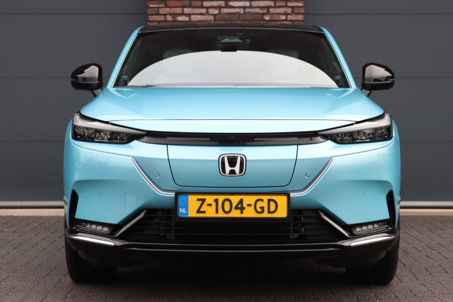 Honda e:Ny1 Elegance 69 kWh | Panoramadak | Adaptieve Cruise Control | Verwarmd Stuurwiel | Leder | Surround Camera | Apple Carplay/Android Auto | Dodehoekassistent | Stoelverwarming |