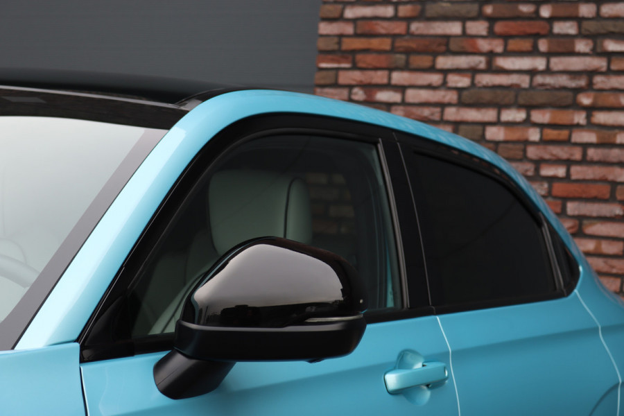 Honda e:Ny1 Elegance 69 kWh | Panoramadak | Adaptieve Cruise Control | Verwarmd Stuurwiel | Leder | Surround Camera | Apple Carplay/Android Auto | Dodehoekassistent | Stoelverwarming |