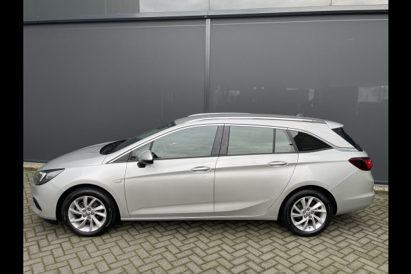 Opel Astra Sports Tourer 1.2 Business Elegance Airco - Cruise control - Parkeersensoren voor en achter - Achteruitrijcamera - Navigatie - Bluetooth - Keyless start and entry - Start/stop systeem - Stuur leder - Stuur multifunctioneel